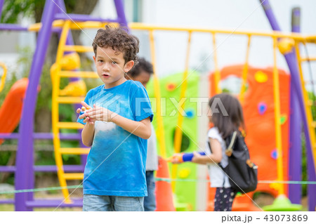 kids boy having fun at children's climbing toy kids boy having fun at children's climbing toy 43073869