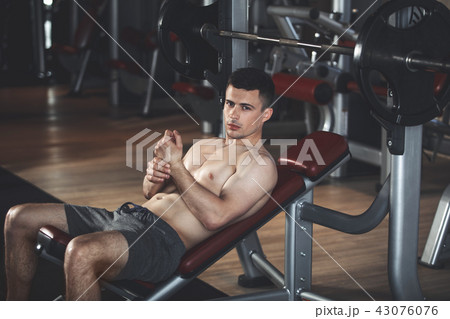 Ambitious athlete is training with equipment indoors 43076076