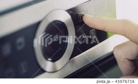 Male finger is touching the button Male finger is touching the button 43076716