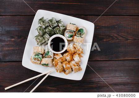 Japanese sushi plate with sauce and chopsticks Japanese sushi plate with sauce and chopsticks 43080000