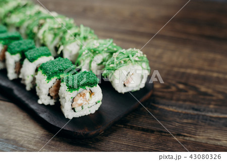 sushi rolls set served on wooden tray, copy space 43080326