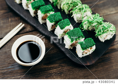sushi rolls plate with sauce and chopsticks sushi rolls plate with sauce and chopsticks 43080341