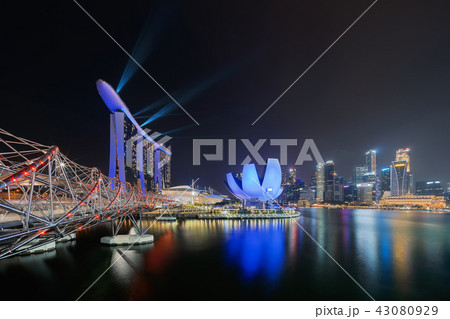 Marina Bay Sands with colorful light show and helix bridge. Down 43080929