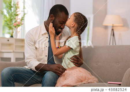 Nice pretty girl kissing her father at home 43082524