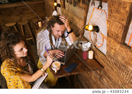 Two young hardworking businessmen working all night Two young hardworking businessmen working all night 43083234