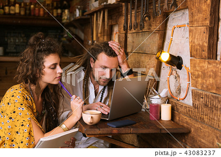 Two young entrepreneurs feeling overloaded while doing accounting Two young entrepreneurs feeling overloaded while doing accounting 43083237