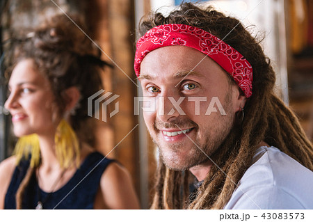 Hippie man smiling while spending time with girlfriend 43083573