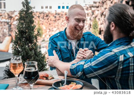 Two bearded brothers feeling happy finally seeing each other 43083618