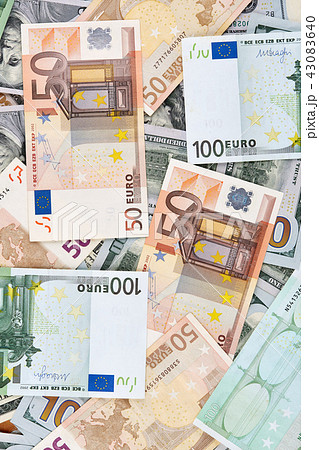A lot of euro and american dollars banknotes. A lot of euro and american dollars banknotes. 43083640