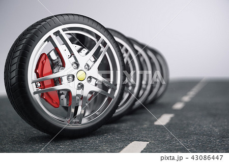 Car wheel, car tire standing on a road. Concept tyres. Car tire with a disc standing on the asphalt 43086447