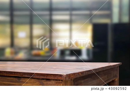 Wood table top on blur kitchen or cafe room background .For mont 43092592
