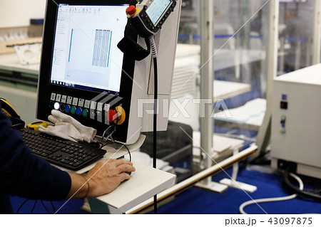 operator controls the industrial equipment 43097875