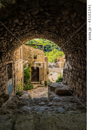 Archway and cobblestone in the village Labeaume 43101341