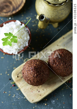 kibbeh, a levantine dish, on a rustic wooden table kibbeh, a levantine dish, on a rustic wooden table 43106325