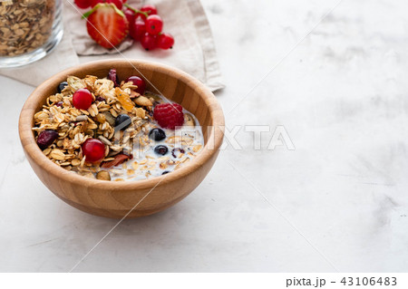 Homemade granola in bowl rustic background. Copy space. 43106483
