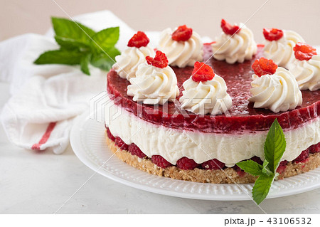 Raspberry cream mousse cake no baked cheesecake on white background. Copy space. Raspberry cream mousse cake no baked cheesecake on white background. Copy space. 43106532