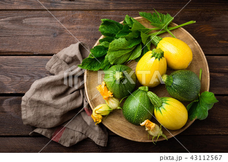 Zucchini with leaves and flowers Zucchini with leaves and flowers 43112567