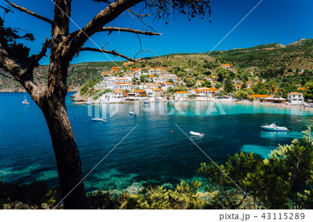 Assos village, Kefalonia Greece. View on turquoise transparent bay lagoon of Mediterranean sea Assos village, Kefalonia Greece. View on turquoise transparent bay lagoon of Mediterranean sea 43115289