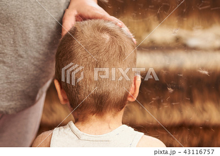 A man cuts machine child at home.  43116757