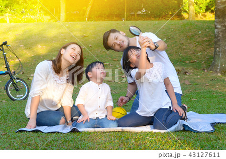 Asian family enjoyed outdoor activity in the park Asian family enjoyed outdoor activity in the park 43127611