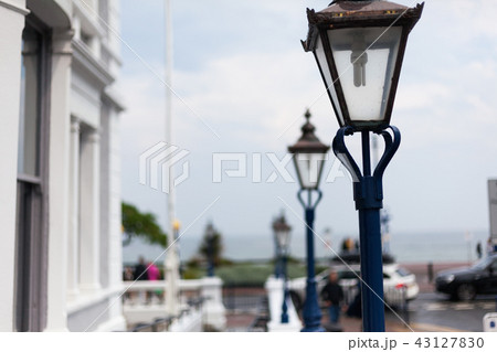 An old-fashioned lamp on the street with blurred An old-fashioned lamp on the street with blurred 43127830