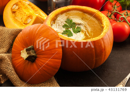 Pumpkin soup with cream in a pumpkin 43131769