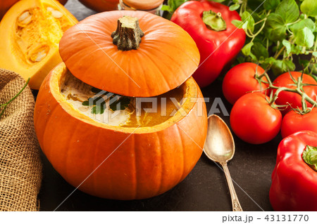 Pumpkin soup with cream in a pumpkin Pumpkin soup with cream in a pumpkin 43131770