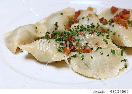 Dumplings with bacon and green chives close up 43132666