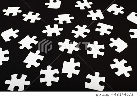 White jigsaw puzzle on black White jigsaw puzzle on black 43144672