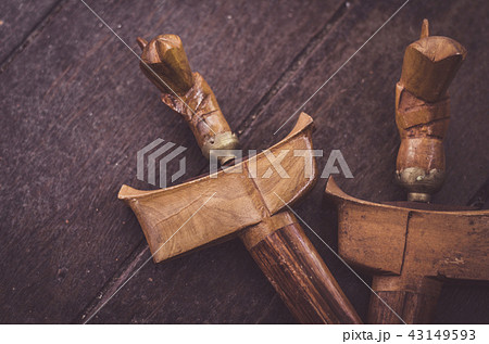 antique malay dagger or Keris on wooden floor antique malay dagger or Keris on wooden floor 43149593