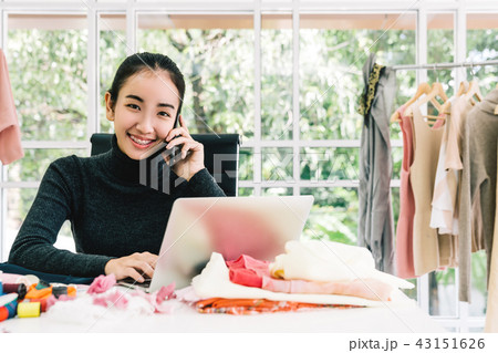 Portrait of happy asian fashion designer smiling Portrait of happy asian fashion designer smiling 43151626