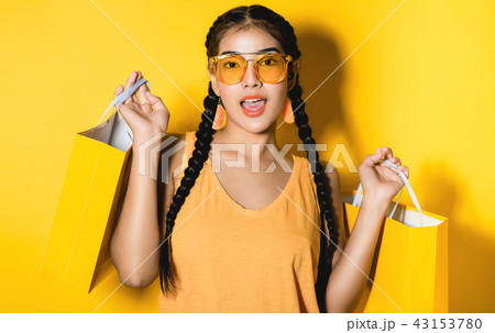 young woman with shopping bags 43153780