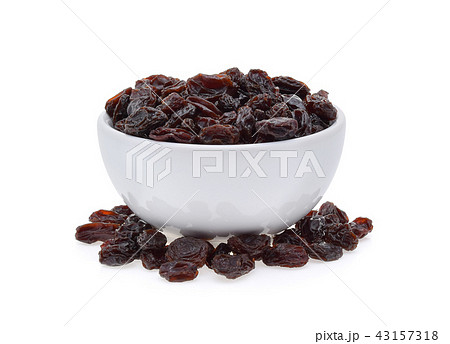 Dried raisins in bowl isolated on white 43157318