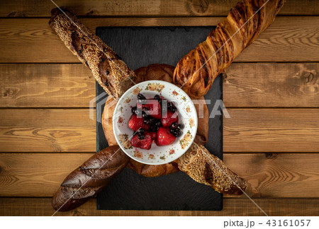 Different types of bread on a wooden background 43161057