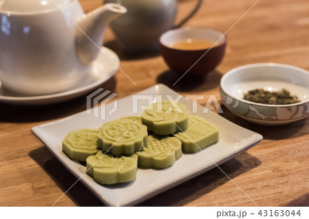 green mooncake on table green mooncake on table 43163044