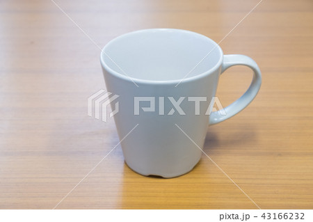 Ceramic mug on the wood table. 43166232