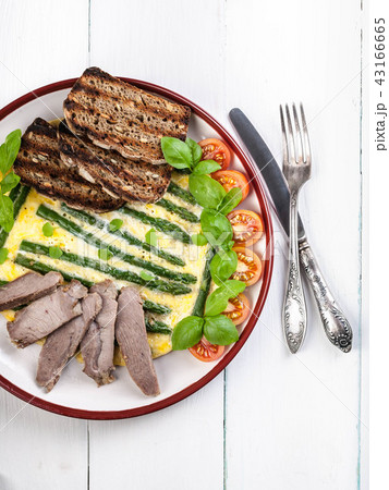 Frittata with asparagus and basil. Vertical shot 43166665