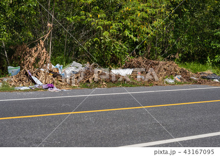 The pile of garbage on the side of road in Phuket. 43167095