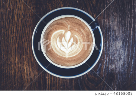 Latte art on the wood table background.  43168005