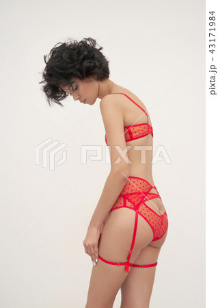 Sensual woman in red lace lingerie Sensual woman in red lace lingerie 43171984