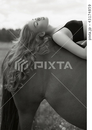 Beautiful young lady with horse Beautiful young lady with horse 43174859