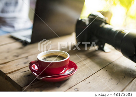 red coffee cup of photographer red coffee cup of photographer 43175603