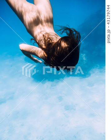 Naked woman dive in ocean, underwater in sea  43179744