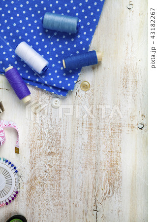 Sewing accessories and blue fabric Sewing accessories and blue fabric 43182267