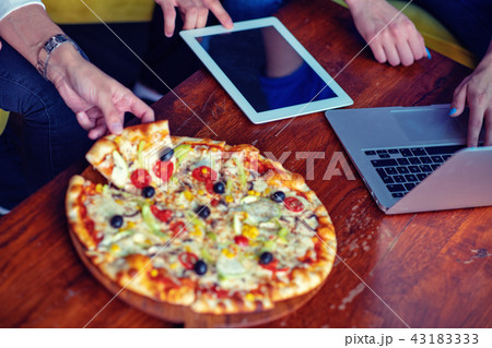 Mock up freelancer workplace. Tablet PC, cell phone and pizza. Top view image. Fast pizza delivery 43183333