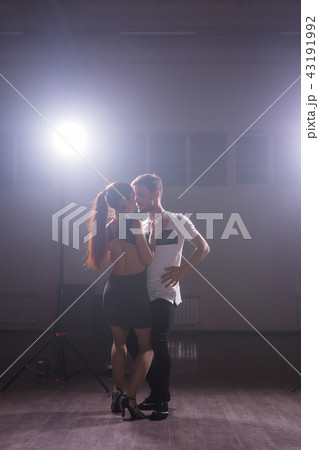 Active happy adults dancing bachata together in dance class 43191992