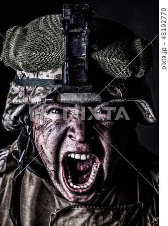 Mad army soldier screaming while looking at camera 43192770