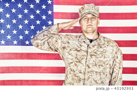 Soldier saluting to national flag of United States Soldier saluting to national flag of United States 43192933