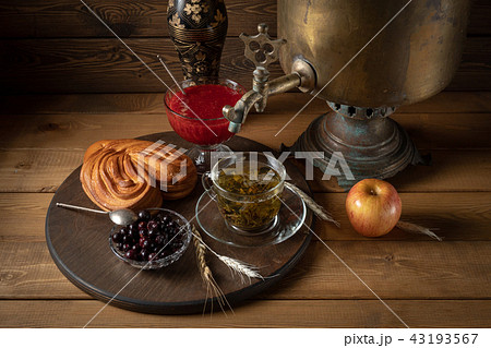 Breakfast. Tea from a samovar with a cheesecake, jam and berries 43193567