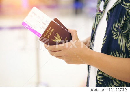 Closeup of man holding Thailand passports Closeup of man holding Thailand passports 43193730